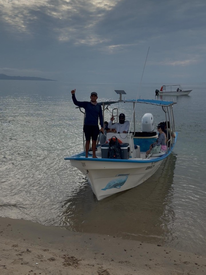 Our boat with guests near the shore